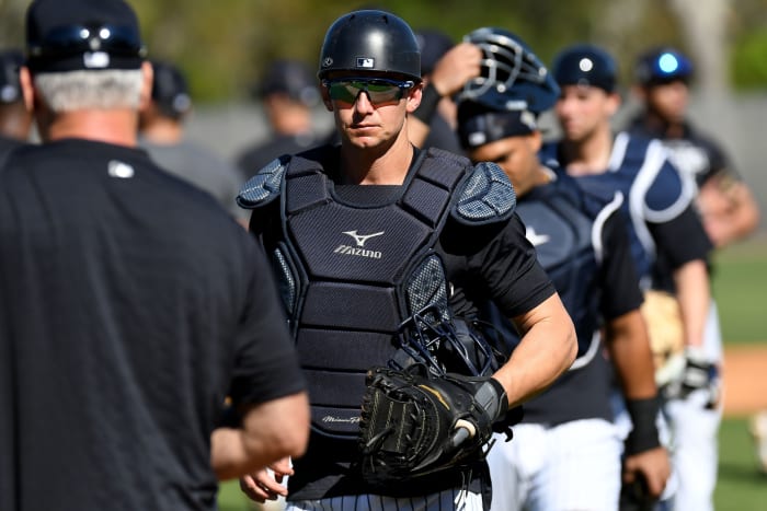 Yankees catcher Rob Brantly participating in catching drills at spring training